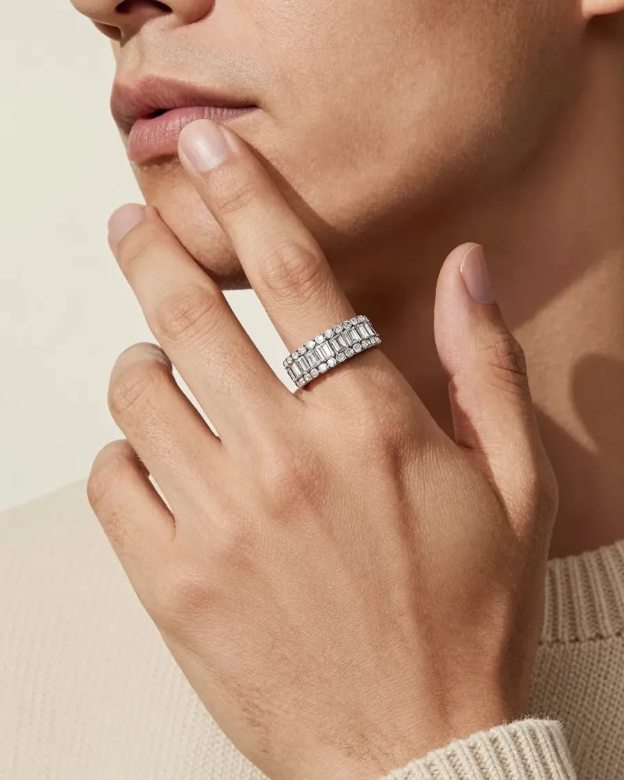 Hand wearing a wide baguette-set ring